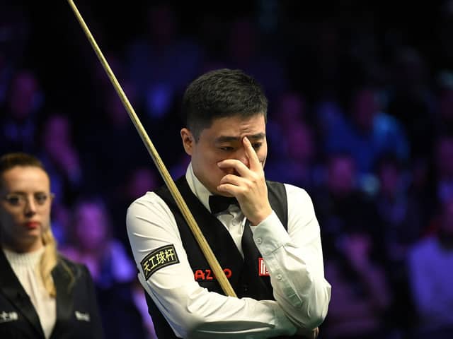Scared to look: China's Ding Junhui, who is based in Sheffield, is back in the top 16 in the world as he looks to build on his run to the UK Championship final in York last December, at the World Championships in Sheffield. (Picture: OLI SCARFF/AFP via Getty Images)