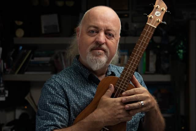 Bill Bailey holding a ukelele. Gillian Robertson/PA.