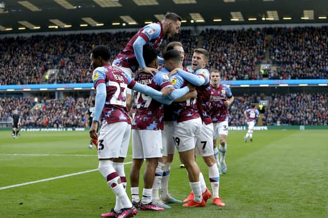 Burnley's Ashley Barnes celebrates with his team-mates after scoring their side's first goal of the game during the Sky Bet Championship match at Turf Moor, Burnley. Picture: Will Matthews/PA