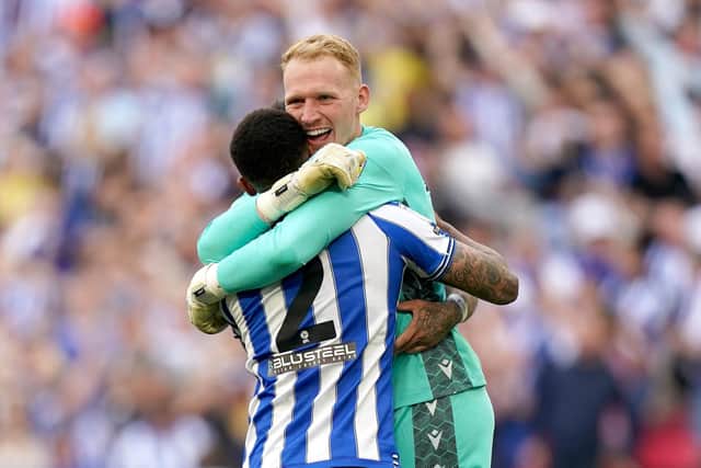 ON THE UP: Sheffield Wednesday goalkeeper Cameron Dawson celebrates with Liam Palmer after winning the League One play-off final  Picture: Mike Egerton/PA