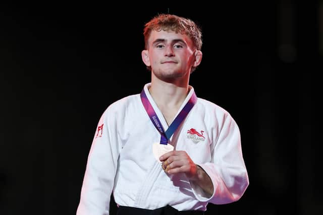 Not the medal I wanted: Bronze medalist Charlie Ayre of Team England poses for a photo during the medal ceremony for the Men -60 kg Judo on day eight of the Glasgow 2026 Commonwealth Games at SEC Centre (Picture: Lintao Zhang/Getty Images)