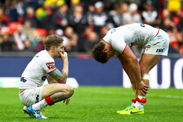 Sam Tomkins, left, looks dejected after the 2013 semi-final loss to New Zealand. (Picture: Alex Whitehead/SWpix.com)