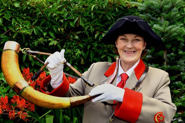 Allison Clark, one of the Ripon hornblowing team, keeping the tradition going by blowing the 1690 horn in her Ripon garden