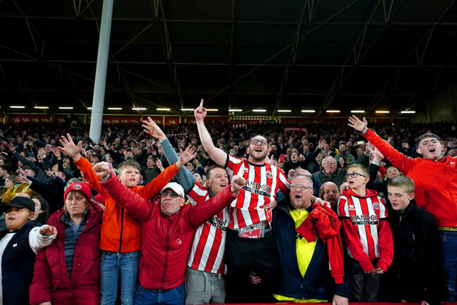Sheffield United fans celebrate being promoted to the Premier League after winning their the Sky Bet Championship match at Bramall Lane, Sheffield. Photo credit: David Davies/PA Wire.
