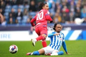 COMMITTED: Huddersfield Town's David Kasumu (right) tackles Blackburn Rovers' Tyrhys Dolan