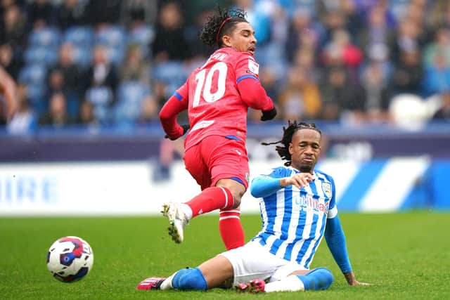 COMMITTED: Huddersfield Town's David Kasumu (right) tackles Blackburn Rovers' Tyrhys Dolan