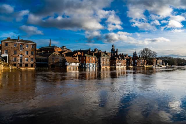Rising flood water from the River Ouse, floods businesses and properties along King's Staith.