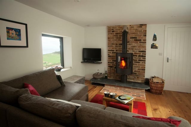 The separate sitting room with wood-burning stove