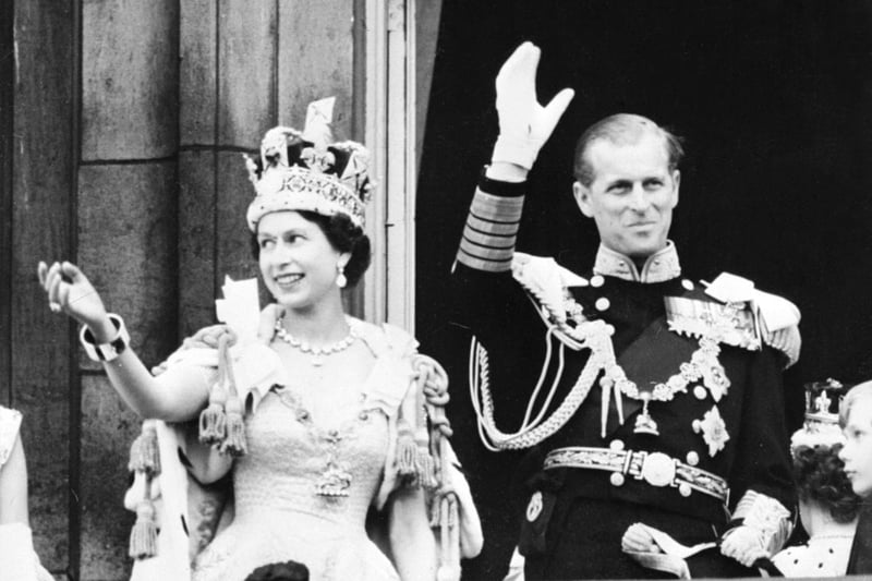 Queen Elizabeth II is accompanied by her husband Prince Philip, Duke of Edinburgh who both wave to the crowd after she is crowned at Westminster Abbey in London.