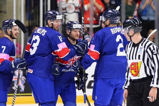 CAPTAIN FANTASTIC: Jonathan Phillips (centre) wants to deliver another promotion to the top tier for GB before he retires from the international game after this week's Division 1A World Championships tournament in Nottingham. Picture: Dean Woolley/Ice Hockey UK
