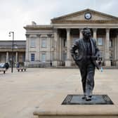 Huddersfield's magnificent railway station with s statue of Harold Wilson in the foreground