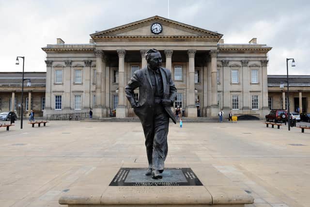 Huddersfield's magnificent railway station with s statue of Harold Wilson in the foreground