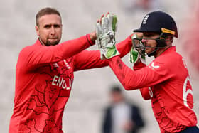 England's Liam Livingstone, left, celebrates his wicket of Ireland's Andrew Balbirnie witha team-mate Jos Buttler during the ICC men's Twenty20 World Cup 2022 cricket match between England and Ireland at Melbourne Cricket Ground (MCG) on October 26 (Picture: WILLIAM WEST/AFP via Getty Images)