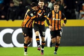 Hull City's Ozan Tufan (left) celebrates scoring against Sunderland with team-mates during the Sky Bet Championship match at MKM Stadium, Hull. Picture date: Saturday December 17, 2022. PA Photo. See PA story SOCCER Hull. Photo credit should read: Ian Hodgson/PA Wire.RESTRICTIONS: EDITORIAL USE ONLY No use with unauthorised audio, video, data, fixture lists, club/league logos or "live" services. Online in-match use limited to 120 images, no video emulation. No use in betting, games or single club/league/player publications.