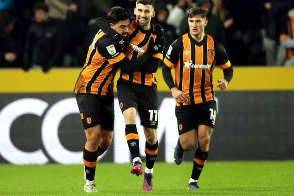Hull City's Ozan Tufan (left) celebrates scoring against Sunderland with team-mates during the Sky Bet Championship match at MKM Stadium, Hull. Picture date: Saturday December 17, 2022. PA Photo. See PA story SOCCER Hull. Photo credit should read: Ian Hodgson/PA Wire.

RESTRICTIONS: EDITORIAL USE ONLY No use with unauthorised audio, video, data, fixture lists, club/league logos or "live" services. Online in-match use limited to 120 images, no video emulation. No use in betting, games or single club/league/player publications.