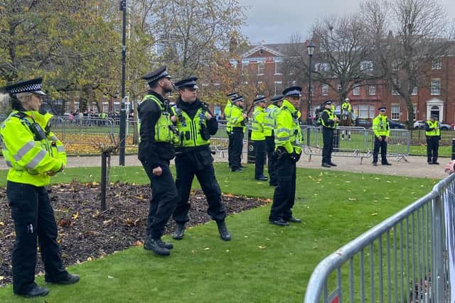 Police watch over demonstrators at Park Square in Leeds