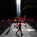 Runners and spectators during the TCS London Marathon on Sunday. PIC: Aaron Chown/PA Wire.