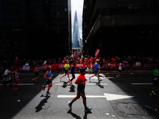 Runners and spectators during the TCS London Marathon on Sunday. PIC: Aaron Chown/PA Wire.
