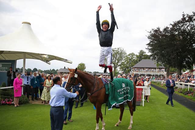 That famous leap: Frankie Dettori celebrates winning the Weatherbys Hamilton Lonsdale Cup Stakes on Stradivarius during Coolmore Nunthorpe day of the Welcome to Yorkshire Ebor Festival 2021 at York racecourse. (Picture: Nigel French/PA)