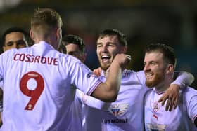 Barnsley player John McAtee (2nd right) celebrates scoring his side's the second goal with the creator Sam Cosgrove during the Sky Bet League One match at Carlisle United at Brunton Park on Tuesday. Photo by Stu Forster/Getty Images.