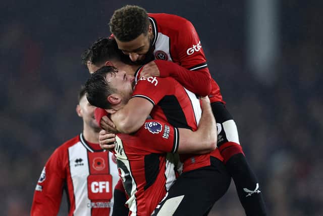 JOY: Jayden Bogle and Jack Robinson celebrate as Sheffield United secure their first Premier League win of the season