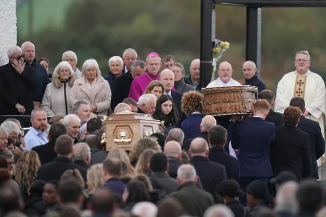 The coffins of Robert Garwe and his five-year-old daughter Shauna Flanagan Garwe, who died following an explosion at the Applegreen service station in the village of Creeslough in Co Donegal are carried into St Michael's Church, in Creeslough, for their funeral mass. Picture date: Saturday October 15, 2022.