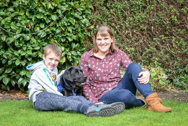Emma Mills, from Sheffield, with son Sam and his support dog Willow. Photo: Ian Kendall