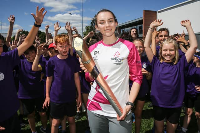 Second chance: Batonbearer Lucy Hadaway holds the Queen's Baton during the Birmingham 2022 Queen's Baton Relay on a visit to the York St. John University Sports Park, (Picture: Nick England/Getty Images for Birmingham 2022 Queen's Baton Relay)