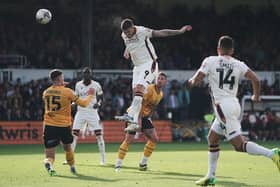 ON FORM: Bradford City's Andy Cook scores a hat-trick and his side's fourth goal against Newport County at Rodney Parade. Picture: Robbie Stephenson/PA