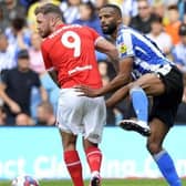 Barnsley's James Norwood battles with Sheffield Wednesday's Michael Ihiekwe in their derby last autumn. Picture: Steve Ellis