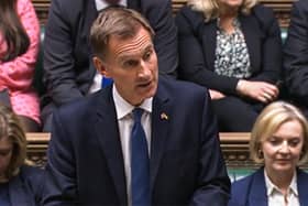 A video grab from footage broadcast by the UK Parliament's Parliamentary Recording Unit (PRU) shows Britain's Chancellor of the Exchequer Jeremy Hunt announcing tax and spending measures, part of medium-term fiscal plan to MPs at the House of Commons, in London, on October 17, 2022. - The British government on October 17, 2022 axed almost all of its debt-fuelled tax cuts unveiled last month to avert fresh markets chaos, in a humiliating climbdown for embattled Prime Minister Liz Truss. The shock move by new finance chief Jeremy Hunt, parachuted into the job on Friday to replace sacked Kwasi Kwarteng, leaves Truss' position in a precarious state after a series of embarrassing U-turns. (Photo by PRU / AFP) / RESTRICTED TO EDITORIAL USE - MANDATORY CREDIT "AFP PHOTO / PRU " - NO MARKETING - NO ADVERTISING CAMPAIGNS - DISTRIBUTED AS A SERVICE TO CLIENTS (Photo by -/PRU/AFP via Getty Images)