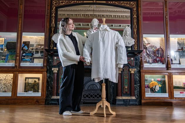 Maddie Toy, collections assistant at The Bankfield Museum, Halifax with the shirt worn by Colin Firth as  Mr Darcy in the 1995 BBC production of Pride and Prejudice, which is going on permanent display, photographed by Tony Johnson for The Yorkshire Post