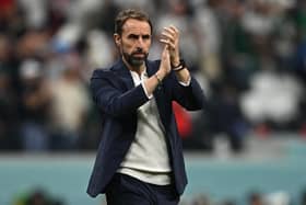 England's coach #00 Gareth Southgate applauds supporters at the end of the Qatar 2022 World Cup Group B football match between England and USA at the Al-Bayt Stadium in Al Khor, north of Doha on November 25, 2022. (Photo by PAUL ELLIS/AFP via Getty Images)