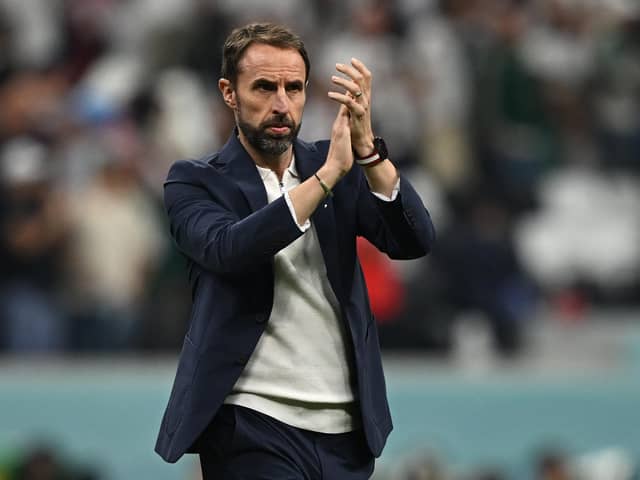 England's coach #00 Gareth Southgate applauds supporters at the end of the Qatar 2022 World Cup Group B football match between England and USA at the Al-Bayt Stadium in Al Khor, north of Doha on November 25, 2022. (Photo by PAUL ELLIS/AFP via Getty Images)