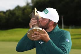 Sealed with a kiss: Dan Brown kisses the trophy after winning the ISPS Handa World Invitational at the Galgorm Castle Golf Club in County Antrim (Picture: Peter Morrison/PA Wire)