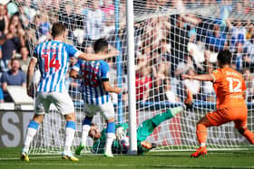 Blackpool goalkeeper Daniel Grimshaw makes a double save to deny Huddersfield Town's Yuta Nakayama a goal (Picture: Tim Goode/PA Wire)