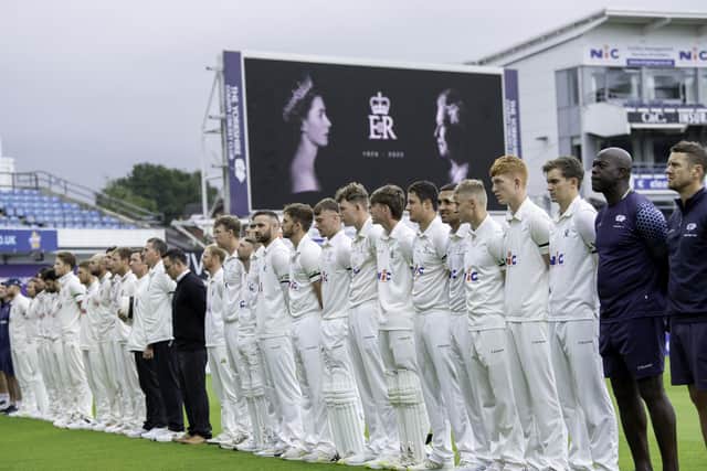 The players and coaches of Yorkshire and Essex stand for a minute's silence in honour of Her Majesty Queen Elizabeth II. Photo by Allan McKenzie/SWpix.com