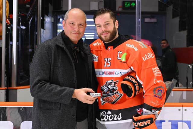 HISTORY: Robert Dowd, right, is presented with the puck which he scored his 330th goal for Sheffield Steelers with by Ron Shudra - moving him one place above the former Steelers' captain into second. Picture: Dean Woolley/Steelers Media.