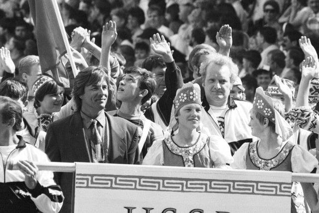 American actor Don Johnson leads the USSR team into Glasgow's Celtic Park for the European Special Olympics in July 1990.