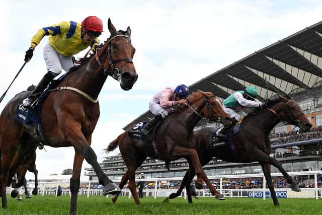 Day to remember: Jockey Sam James rides Poptronic to victory in the British Champions Fillies and Mares Stakes on Qipco British Champions Day at Ascot Racecourse. It was his first Group One win on his first day riding at the UK's richest meeting.
(Photo by GLYN KIRK/AFP via Getty Images)