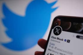 A phone displays the Twitter account for Elon Musk, showing the new logo for Twitter, and the website address X.com. Twitter has replaced the social media platform's famous bird logo with an X as part of owner Elon Musk's plans to create an "everything app".