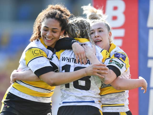 Olivia Whitehead of York City Knights Ladies celebrates with teammates Hollie Dodd and Savannah Andrade after scoring a try against Wigan Warriors Women in the Challenge Cup earlier this season (Picture: Will Palmer/SWPix.com)