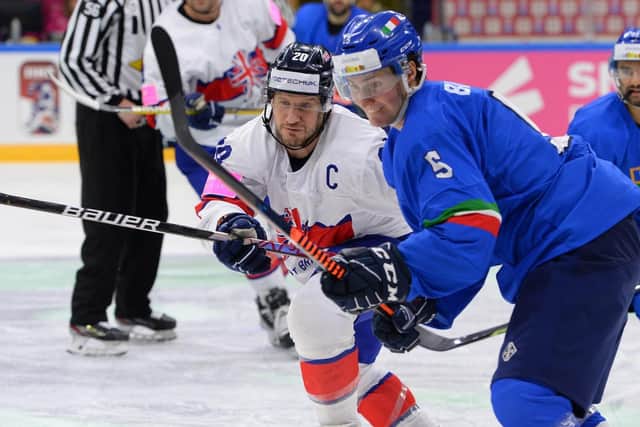 CAPTAIN FANTASTIC: Jonathan Phillips battles for the puck in Friday night's World Championship clash with Italy at Nottingham;s Motorpoint Arena. Picture courtesy of Dean Woolley/Ice Hockey UK.