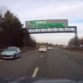 A Peugeot 206 barrelling down the left-hand lane on the A19.