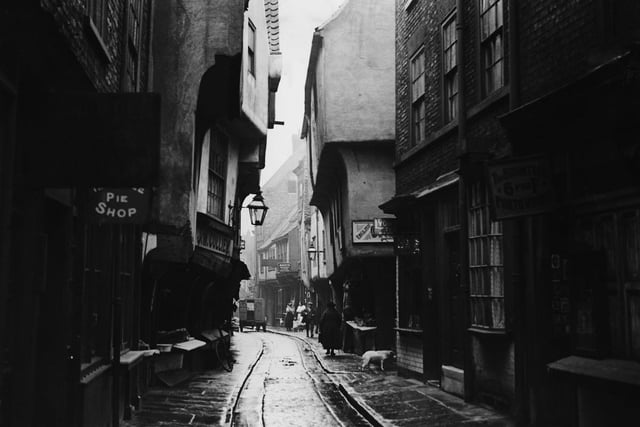 A pie shop, photo works and Lyons Tea Room in Jubbergate, The Shambles, York in the 1900s.