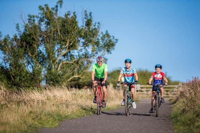 Cyclists riding along the Cinder Track. (Pic credit: Route YC)