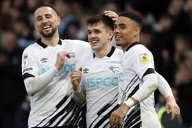 Derby County's Jason Knight (centre) celebrates scoring his side's fifth goal with team mates - but which Derby players make the cut in the latest team of the week.