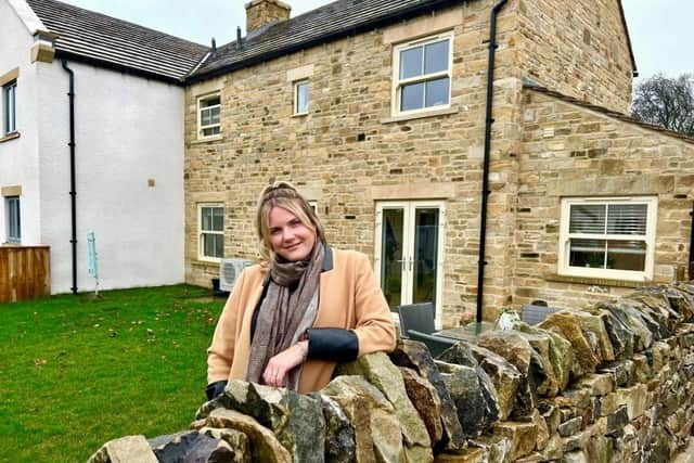 Carly Thompson outside her new home in West Witton