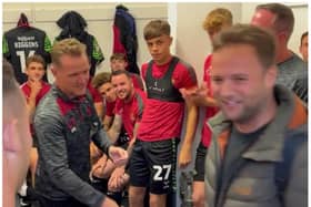 Jack Peat (right) meets Gary McSheffrey and Rovers' players after his marathon journey to Barrow. (Photo: Doncaster Rovers).