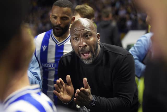 Darren Moore gathers his Sheffield Wednesday players into a huddle before the penalty shoot-out against Peterborough United. Picture: Steve Ellis